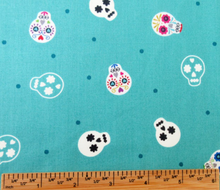 Load image into Gallery viewer, Lewis & Irene - Small Things Glow - Sugar Skulls on Turquoise - 1/2 YARD CUT
